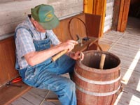 Volunteer, Bert Montgomery repairing an old barrel