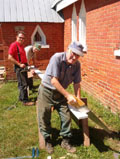 Volunteers, Bill Oattes, Murray Dittburner and Rick Renault recapture the ancient art of tuckpointing hundred-year-old bricks. 